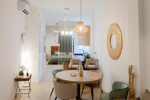 a dining room with a table and chairs at Luxury central apartment in Madrid