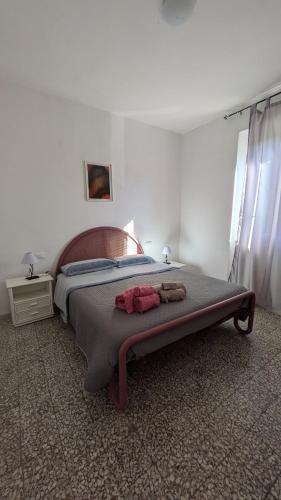 Postel nebo postele na pokoji v ubytování Casa Maddi Casa Vacanze con Vista Mare Vicinissima al Centro Capoliveri Isola d'Elba