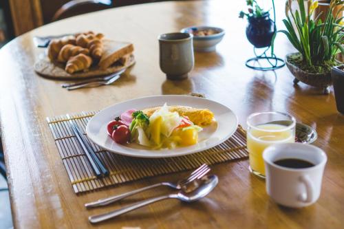 a plate of food on a table with a plate of food at Silverhorn in Myoko