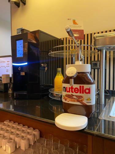 a counter with a bottle of nutella next to a counter at Aparthotel Siente Boí & SPA in Pla de l'Ermita