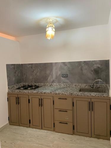 a kitchen with a counter top and a sink at Nomad Surf Lodge in Imsouane