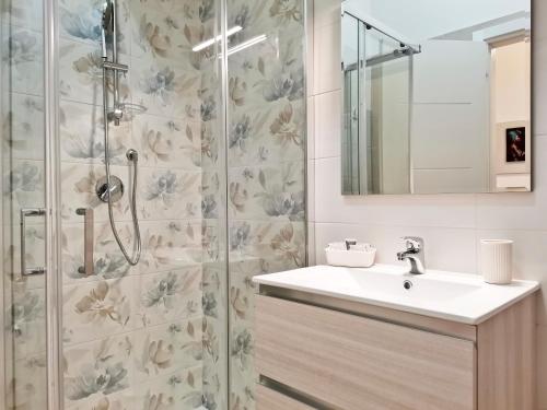 a bathroom with a sink and a shower at L'altro Krisà in Bari
