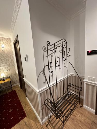a metal bench on the side of a stairway at Hotel Boutique Cathedral Plaza Residences room for rent downtown in Bucharest