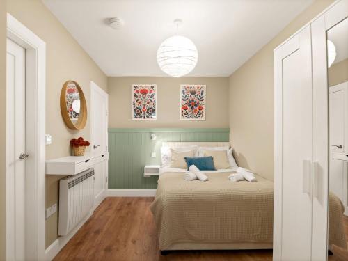 a bedroom with a bed with two towels on it at Apartment 297 - Clifden in Clifden