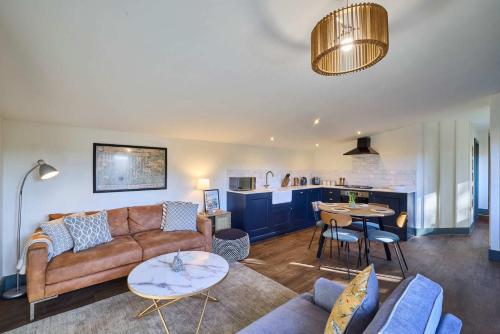 a living room with a couch and a table at Host & Stay - The Lodge in Whitby
