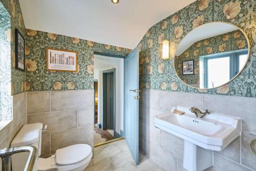 a bathroom with a sink and a mirror at Host & Stay - The Lodge in Whitby