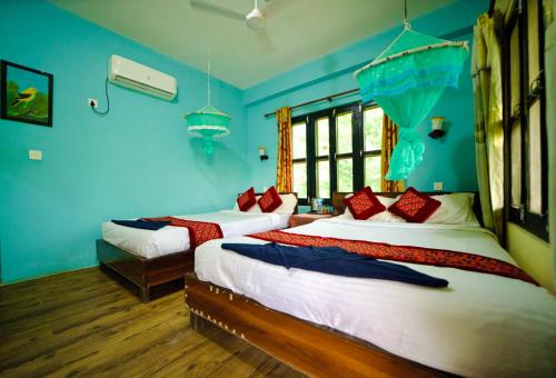 Chitwan Gaida Lodge - Animal Lovers & Birdwatchers Paradiseにあるベッド