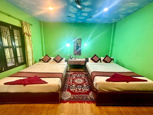 Chitwan Gaida Lodge - Animal Lovers & Birdwatchers Paradiseにあるベッド