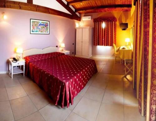 Postel nebo postele na pokoji v ubytování Hotel La Tortiola