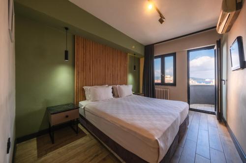 Postel nebo postele na pokoji v ubytování Polek Hotel
