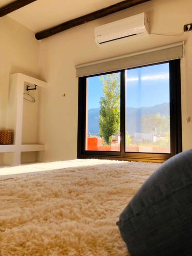 a large room with a large window with a view at WAYTAY in Cafayate