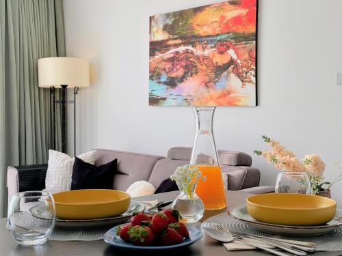 a living room with a table with food on it at City Centre Luxury Residence with Pool near Dunya IVF & Beach in Kérynia