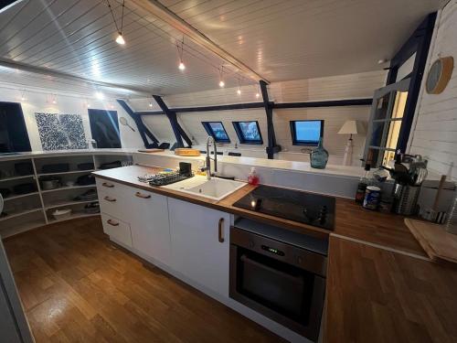 a kitchen with a sink and a counter top at Le Bleu d 'Audinghen in Audinghen
