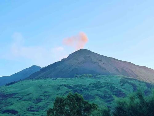 a mountain with a fire on top of it at Il Nido in Stromboli
