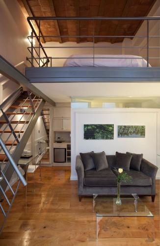 a living room with a couch and a bunk bed at San Telmo Suites in Buenos Aires