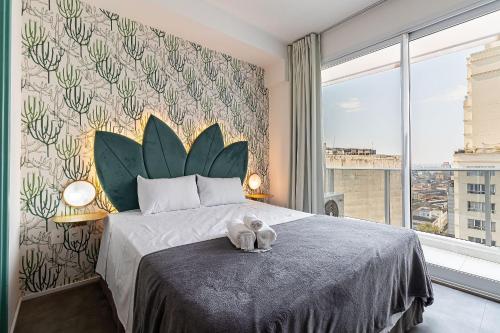 a bedroom with a bed with two stuffed animals on it at Studio - Setin Downtown Estação Luz - Sou House in São Paulo