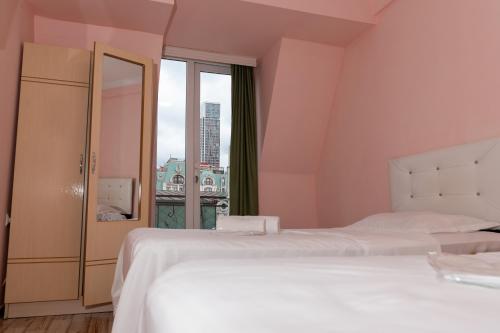 Postel nebo postele na pokoji v ubytování Hotel Ponto Vechio