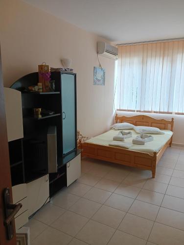 Llit o llits en una habitació de Apartment Orhideya