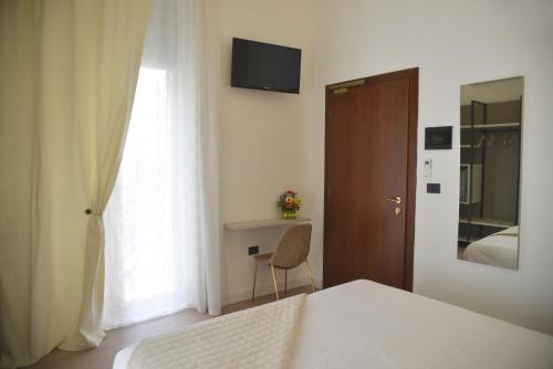 TV a/nebo společenská místnost v ubytování Hotel Torino