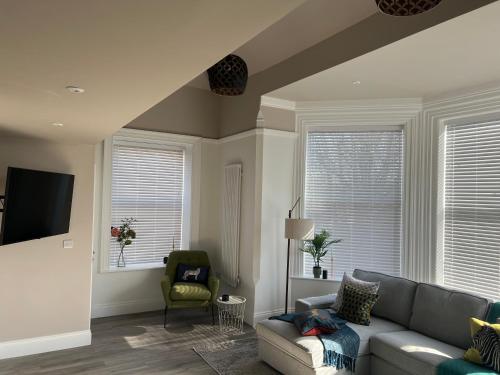 a living room with a couch and a chair at On The Avenue Apt 4 in Nottingham