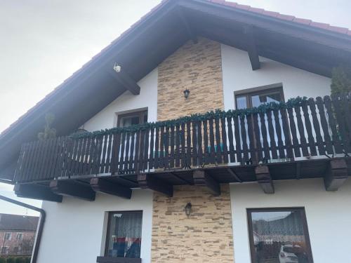 a balcony on the side of a building at Květinové apartmány Horní Planá in Horní Planá