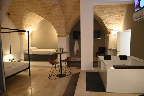 a room with a bedroom and a bed and a bathroom at La Dimora di Cesare Braico in Brindisi