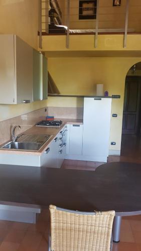 a kitchen with a sink and a counter top at appartamento incantevole in Mirandola