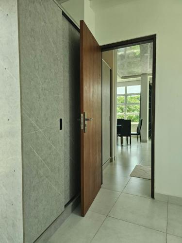 a door leading to a dining room with a table at Shams Thoddoo in Thoddoo