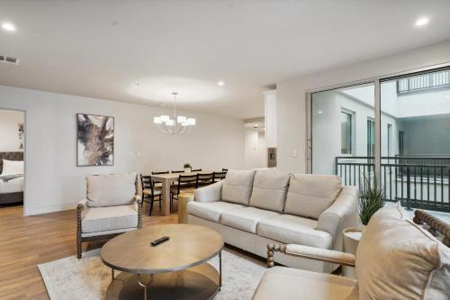 a living room with a couch and a table at The Eleanor New Orleans in New Orleans