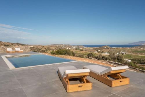 a villa with a pool and a view of the ocean at Sunrise Poem Villa 1 in Prodromos Paros