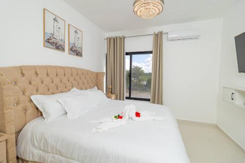 Ένα ή περισσότερα κρεβάτια σε δωμάτιο στο Serene 2-Bedroom Coastal Retreat in Bayahibe