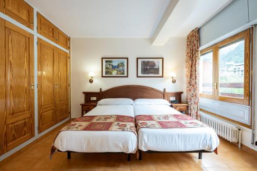 Postel nebo postele na pokoji v ubytování Montecarlo