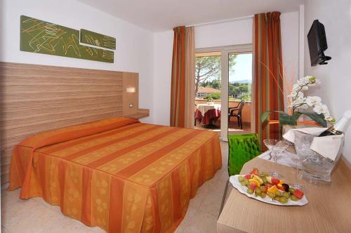 Postel nebo postele na pokoji v ubytování Hotel Riva dei Cavalleggeri