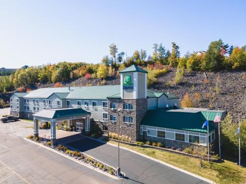 an aerial view of a building with a clock tower at Holiday Inn Express Houghton-Keweenaw by IHG in Houghton