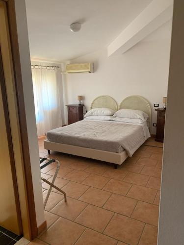 Postel nebo postele na pokoji v ubytování Albergo Ristorante Locanda Rosella