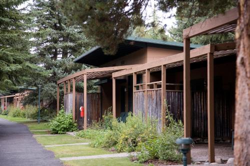 a brown building with a fire hydrant in front of it at Jackson Lake Lodge in Moran