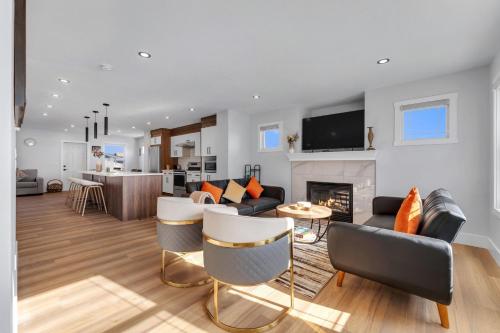 a living room with a couch and a fireplace at Your Pleasant stay in 3 bedroom House in Saddle-Ridge in Calgary