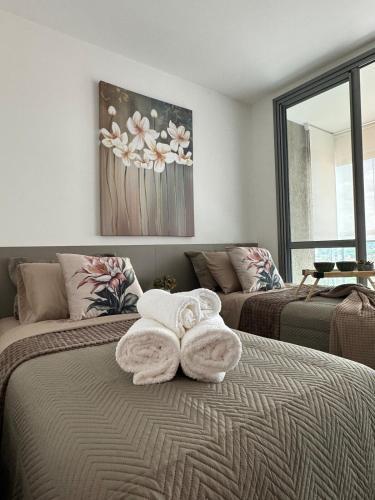 Apt 86 Fiusa One - Charmoso!にあるベッド
