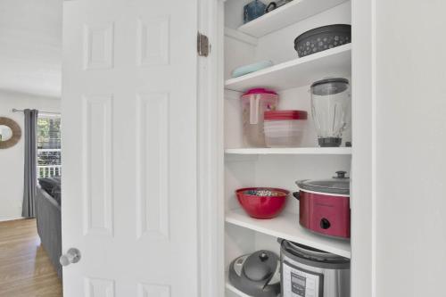 a kitchen with a pantry filled with lots of appliances at Private Beach-Private Pool-Easy walk to the Beach in Gulf Highlands