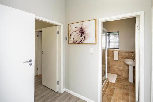 a bathroom with a toilet and a sink at Modern Executive Unit in East London