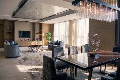 a dining room with a table and chairs at Pullman Changshu Leeman in Changshu