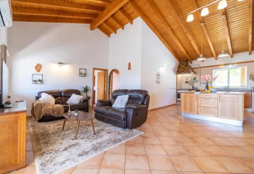 a living room with a couch and a table at room in Casa VERANEAR in Aljezur