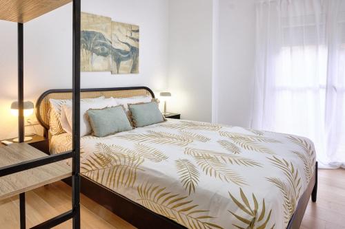 a bedroom with a bed with a metal bed frame at Rincón con Encanto en el Centro Histórico in Cartagena