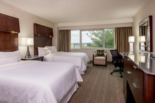 a hotel room with two beds and a window at The Westin Waltham Boston in Waltham