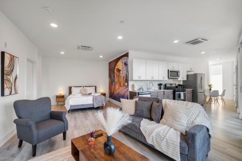 a living room with a couch and a bedroom at Urban Retreat Studio - Balcony Smart Design in Philadelphia