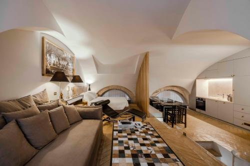 a living room with a couch and a checkered floor at Piazza Navona Luxury Loft in Rome