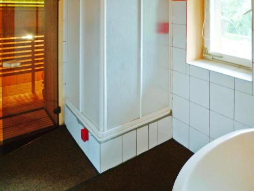 a bathroom with a toilet and a window at House in Wiejkowo near Szczecin Lagoon in Wiejkowo