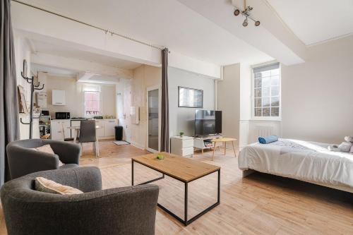 Postel nebo postele na pokoji v ubytování Appartement de caractère hyper centre