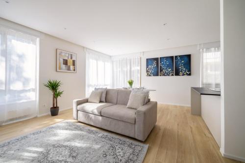 a living room with a couch and a table at Family Joy - Close to city centre in Lugano