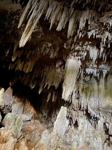 a cave with some ice formations in it at Lainkalogos Glamping in Rabia
